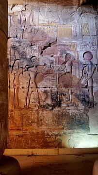 Ancient Egyptian temple corridor at the Abydos Temple with richly detailed hieroglyphs and impressive stone architecture. Egypt