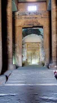 Ancient Egyptian temple corridor at the Abydos Temple with richly detailed hieroglyphs and impressive stone architecture. Egypt