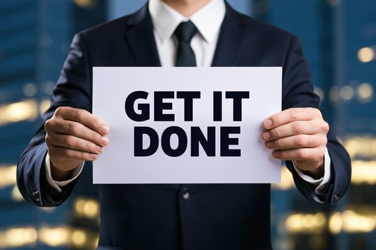 Executive holding get it done action motivational sign