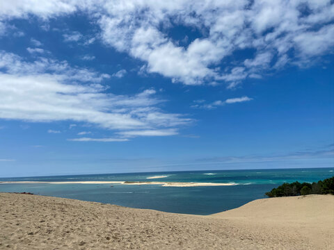 Dune of Pilat panoramic Atlantic coast view over Arcachon Bay under summer clouds, France