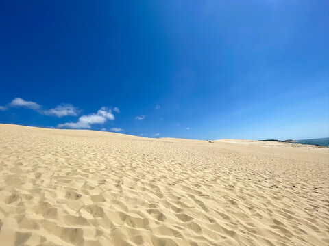 Dune of Pilat panoramic Atlantic coast view over Arcachon Bay under summer clouds, France