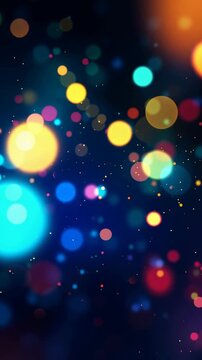 Colorful bokeh lights particles floating and sparkling on a dark blue background. Abstract festive celebration animation for christmas, new year, or party event