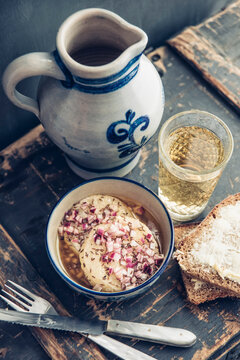 Glass and jar of Hessian cider and bowl of hand cheese