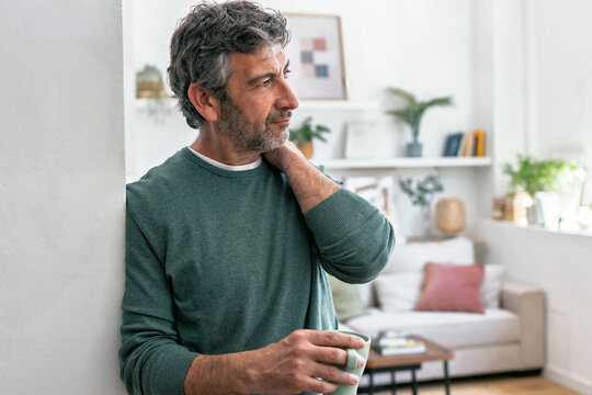Relaxing at home with a morning coffee feeling contemplative