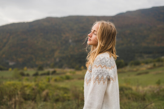 Young woman wearing pullover outdoors