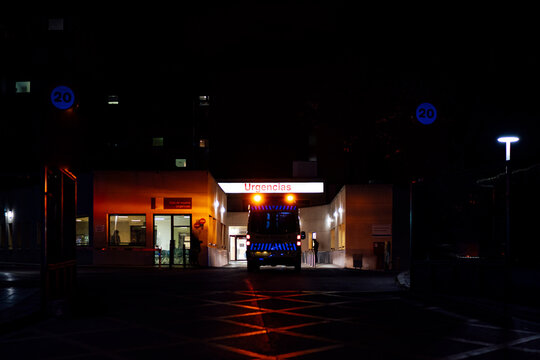 Ambulance on emergency mission at hospital, Madrid, Spain