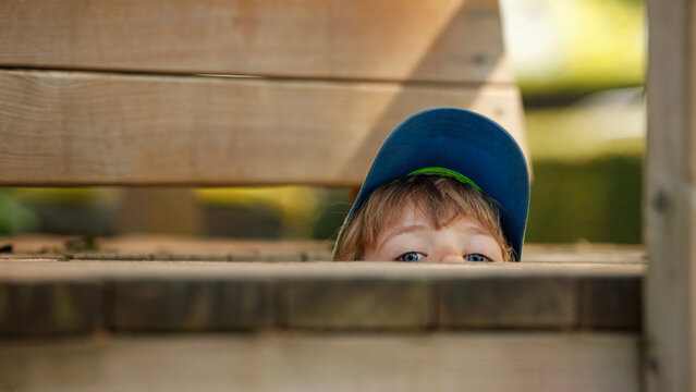 Little boy hiding at playground