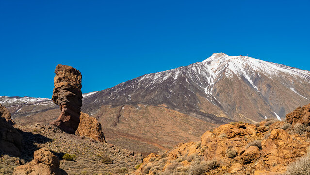 Snowcapped Mount Teide and Roque Cinchado in Tenerife Spain