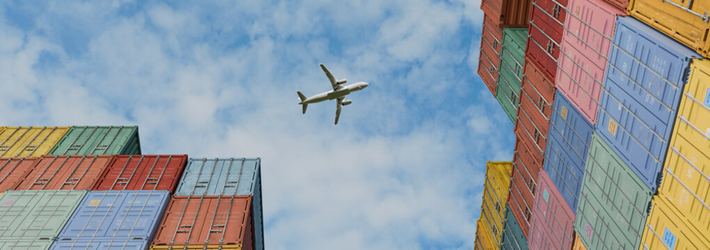 Airplane Flying Over Colorful Stacked Shipping Containers at Cargo Port, Low Angle View of Global Logistics
