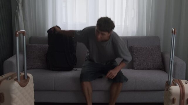 Fresh start in a new home. Man arriving at rented apartment, looking around and settling into a new chapter of life
