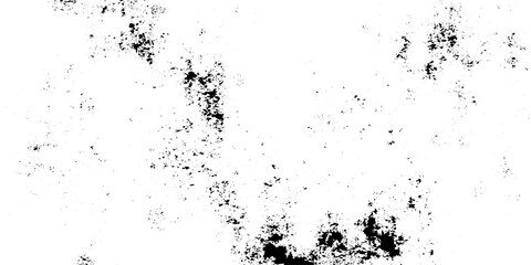 Fototapeta premium A minimal abstract scene of scattered black ink splatters and dust particles drifting across a clean white background. dirty grain and noise texture. 