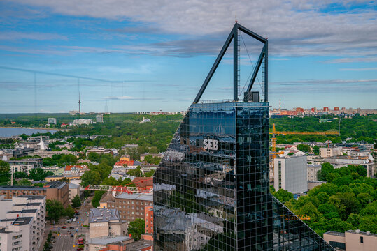TALLINN, ESTONIA - JUNE 25, 2026: Modern SEB bank headquarters skyscraper and city skyline.