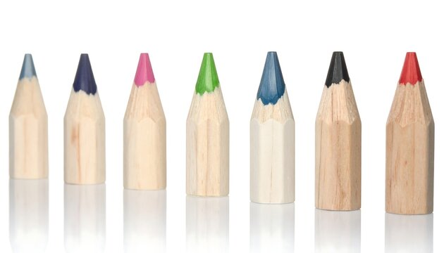 A row of seven colored pencils with vibrant tips