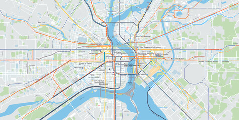 Obraz premium A detailed overhead view of a city map showing a river, bridges, roads, and public transport lines, highlighting urban infrastructure and connectivity.