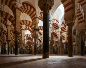 Fototapeta premium Ancient striped arches of Mezquita-Cathedral in Cordoba, Spain