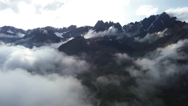 Cinematic Drone Shot of Misty Alpine Mountain Range