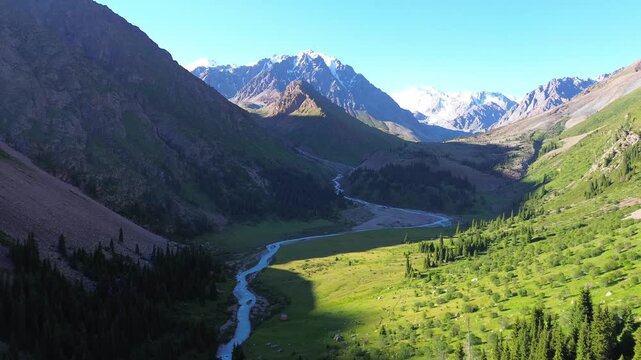 Cinematic Flight Along a River in a Mountain Valley