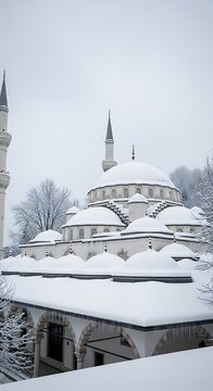A snow-covered mosque with multiple domes and minarets