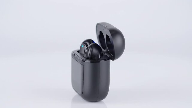 Black wireless earbuds in open charging case rotating on clean background, modern true wireless stereo earphones, Bluetooth audio technology, premium 3D product showcase animation