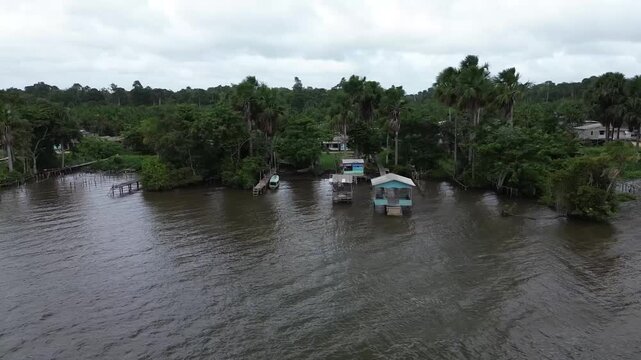Aerial drone view of a traditional riverside community in the Brazilian Amazon rainforest