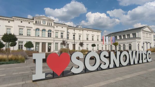 Sign, Main Railway Station in background. Sosnowiec, Poland.