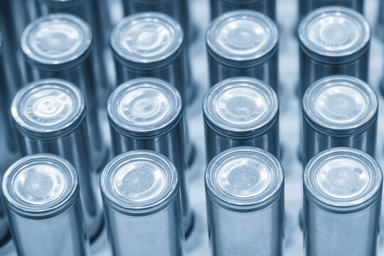 Close-up of a high-capacity EV battery cell component in a futuristic blue tone scene.