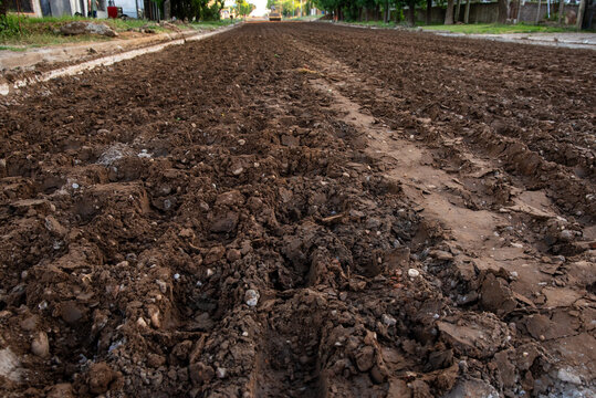 Close-up of Rough Soil Texture and Subgrade on Dirt Road Construction Site