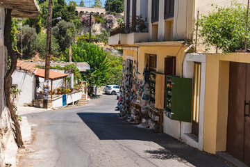 Fototapeta premium narrow streets of a small Greek town in summer