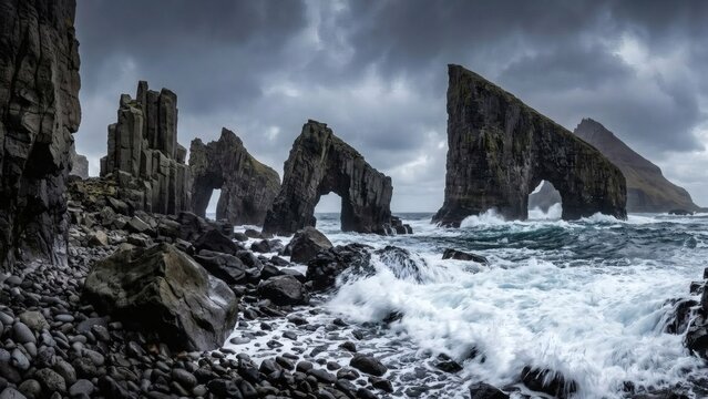 Sculpted dark basalt sea stacks and a large rocky sea arch in the Faroe Islands