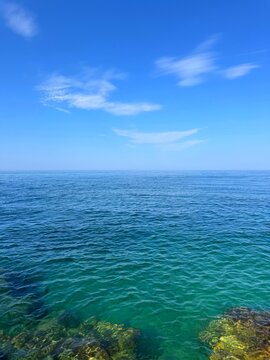 Mediterranean sea and clear sunny sky in summer vertical.