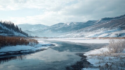 Fototapeta premium A serene winter landscape with a frozen river and snow-covered hills,