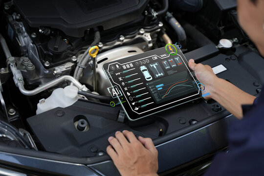 Automotive mechanics test customer service concepts using automotive diagnostic tools and artificial intelligence (AI) on laptops to verify quality.