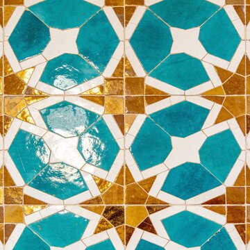 Traditional Moroccan zellige ceramic mosaic tile pattern in turquoise and gold