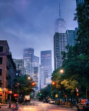 Foggy New York City Street with One World Trade Center at Dawn