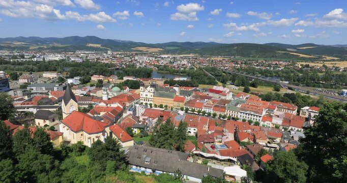 4k panning right motion high angle panoramic view of the city of Trencin, view taken from the Trencin Castle with Peace Square in foreground which is the historic heart of the city, Trencin, Slovakia
