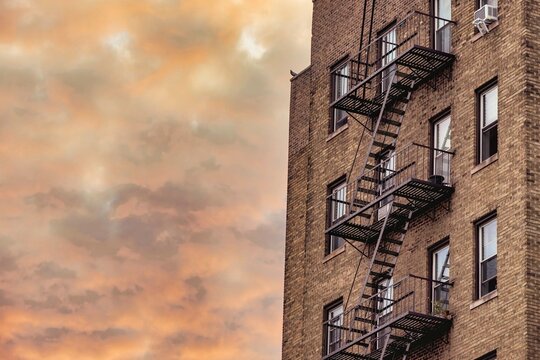 New York City Fire Escape on Brick Building at Sunset