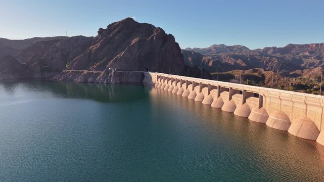 Aerial view of Valle Grande dam and reservoir at sunset in San Rafael, Argentina