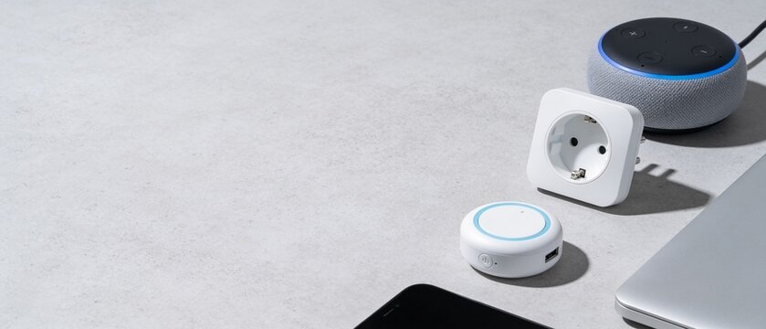 Minimalist smart plug and device setup on sleek workspace for modern home automation