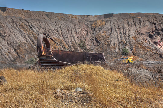 The rusted steel bucket from the old dragline in a Zambian coalmine.