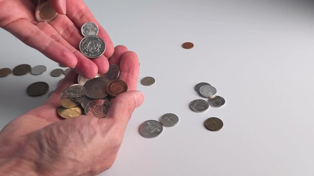Counting coins and sorting different types of money on a table in a simple way