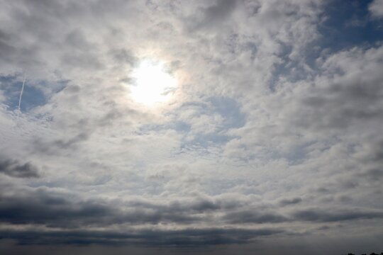 The white clouds in the cloudy skies.