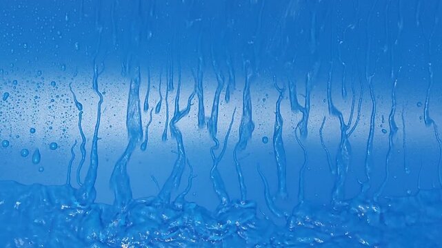 Exploring flowing water on an abstract blue background in four frames
