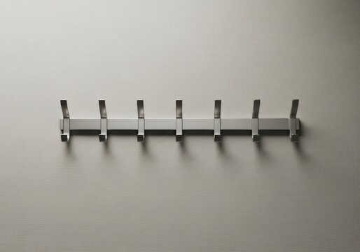 Modern brushed metal wall coat rack with seven double hooks.