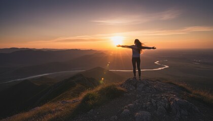 Obraz premium Person embracing the magnificent wilderness panorama from a high vantage point