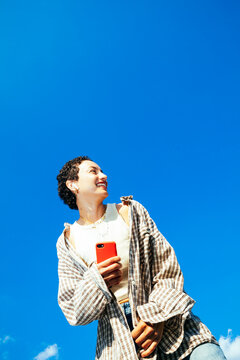 Smiling Woman With Smartphone