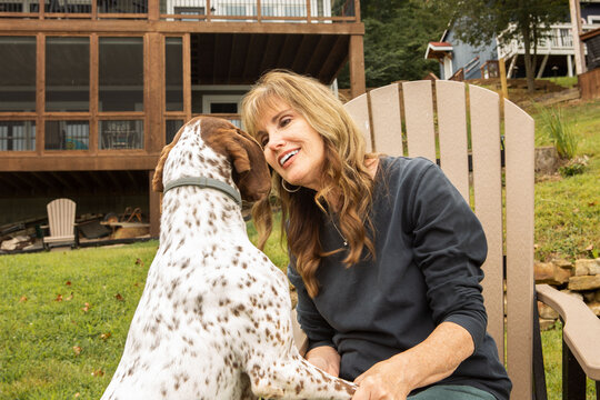 Happy Woman Playing with German Shorthaired Pointer