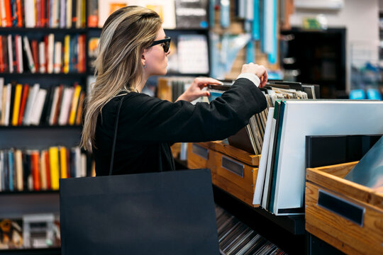 Woman in vinyl record store