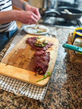 Cook Prepares Meat Rolls With Filling in Kitchen
