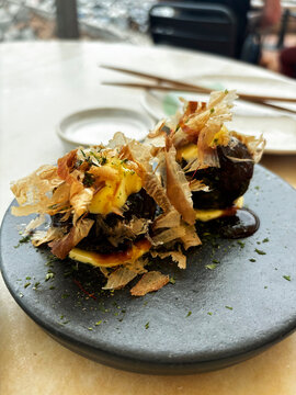 Delicious Dish Served on a Black Plate at a Restaurant