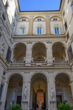Courtyard of Palazzo Mattei di Giove with ancient Roman statues and classical loggia, designed by Carlo Maderno, Rome, Italy